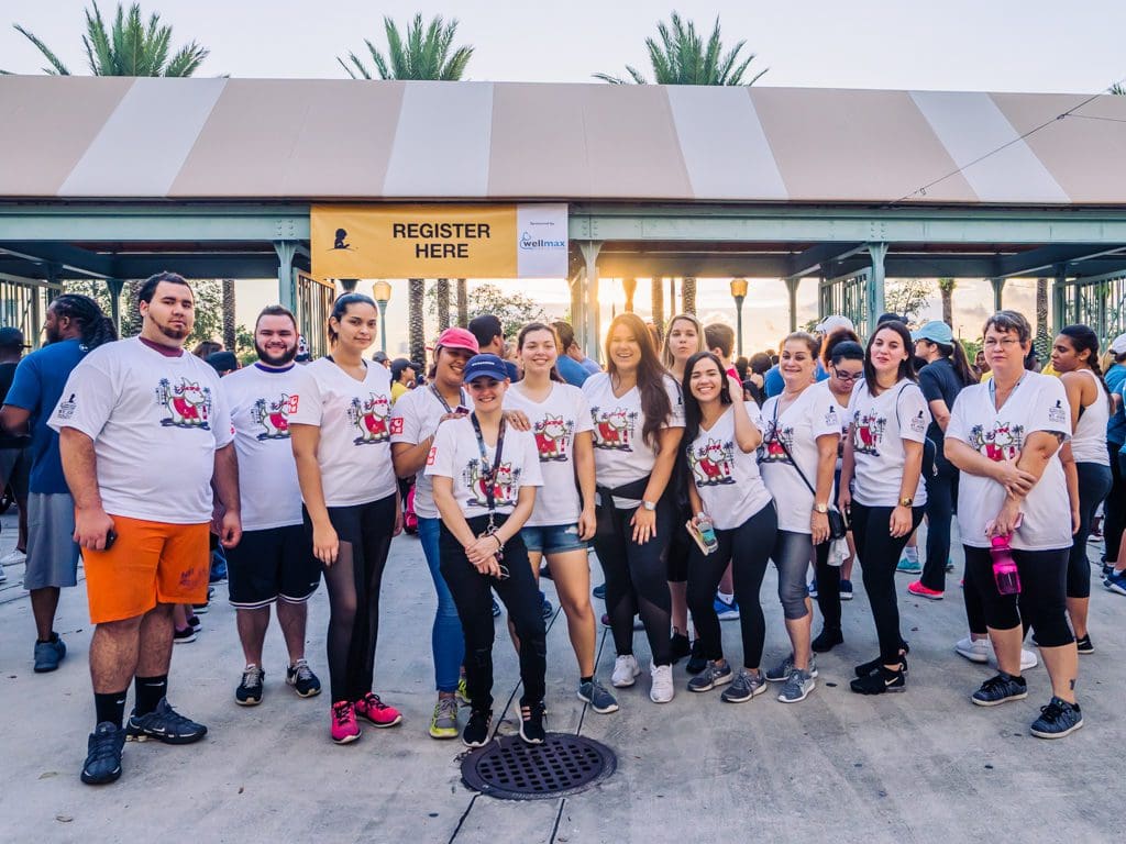 Petland Miami team poses together before joining the fight against childhood cancer at the St. Jude Walk.